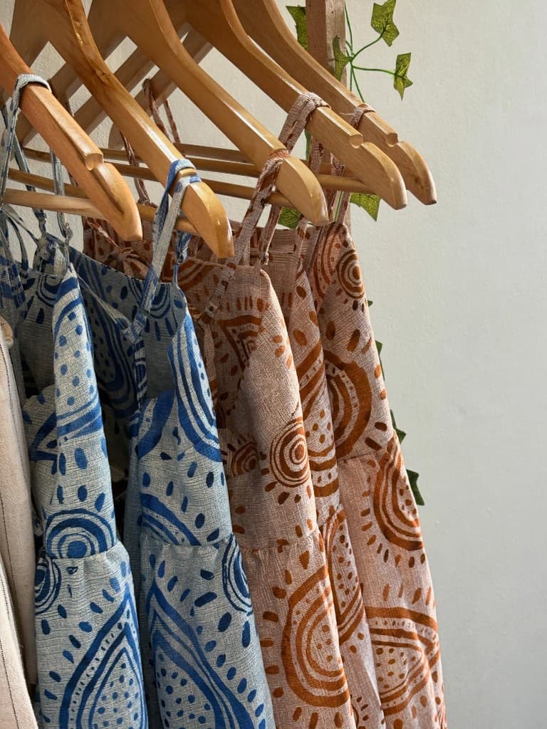 Printed linen dresses on natural wooden hangers